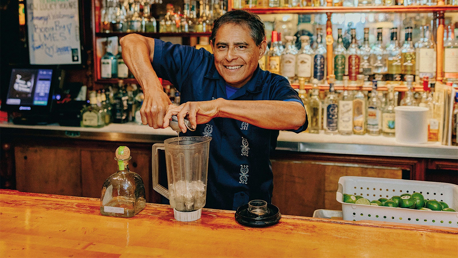 Julio Bermejo makes a tequila cocktail behind the bar at Tommy's restaurant in San Francisco.